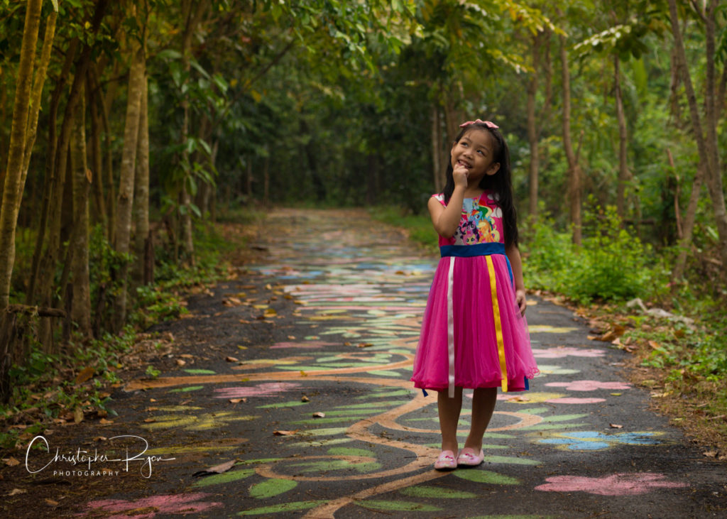 little girl princess in fairytale land wearing pink shoes