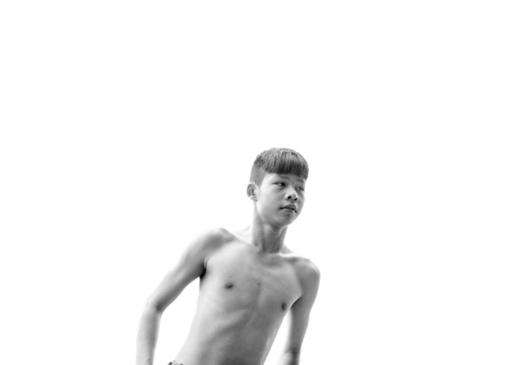 black and white image of beautiful shirtless teen boy