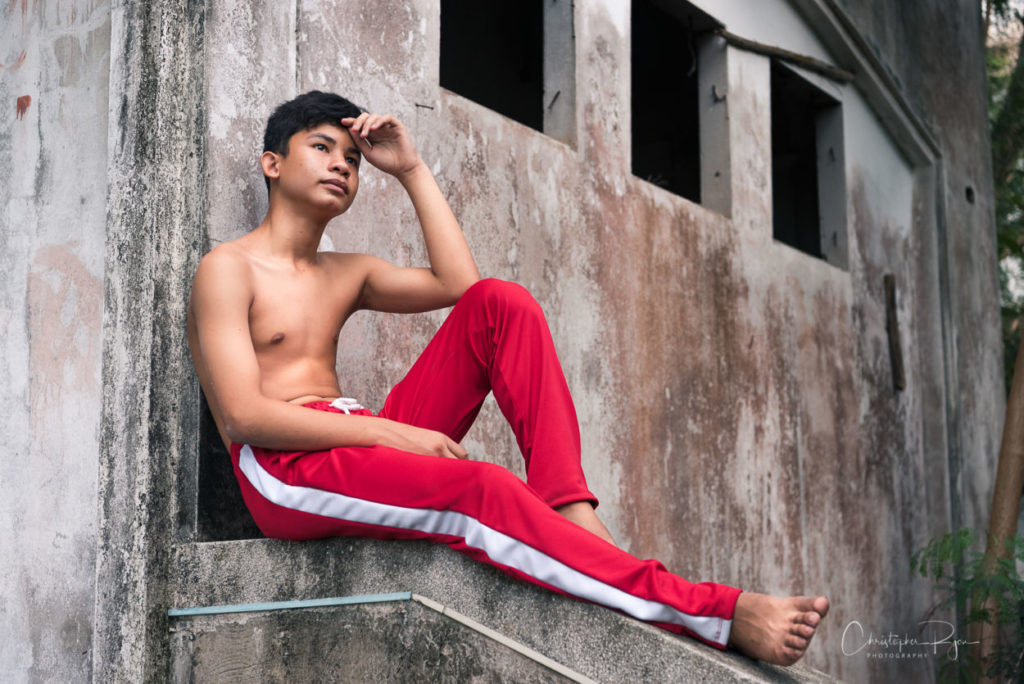shirtless teen boy showing bare feet