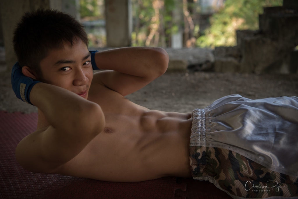 cute shirtless boy with amazing six pack abs.