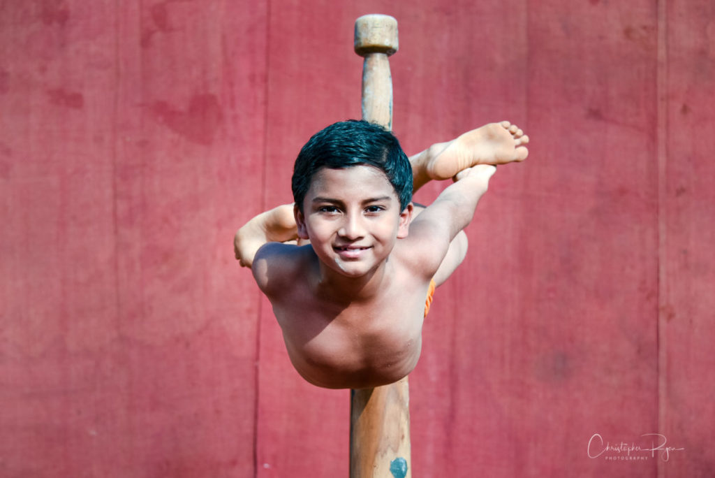 Somansh Dalvi, age 10 performing Matsyasan on Pole Mallakhamb