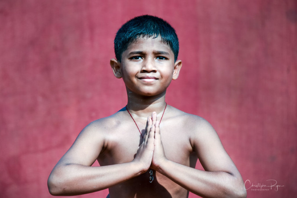 Atharav Kale, 10 year old shirtless boy Peforming Sitting postion on Pole Mallakhamb at Shree Samartha Vyayam Mandir in Mumbai, India
