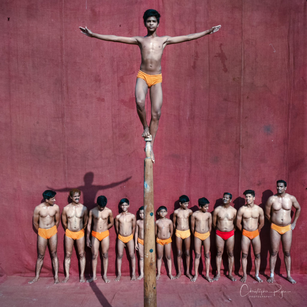 Prajyot Kaskar 14 performing Hanumantasan on Pole Mallakhamb at Shree Samartha Vyayam Mandir in Mumbai, India
