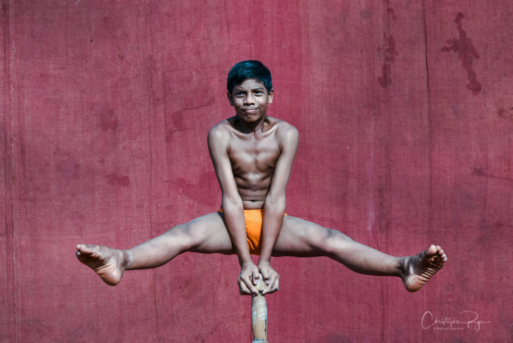 14 year old shirtless pole mallakhamb performer in mumbai, india